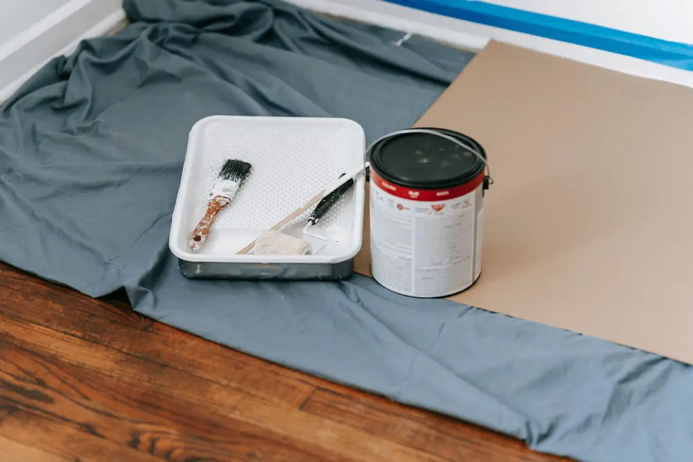 Paint roller and tray ready for interior painting in Nashua, NH